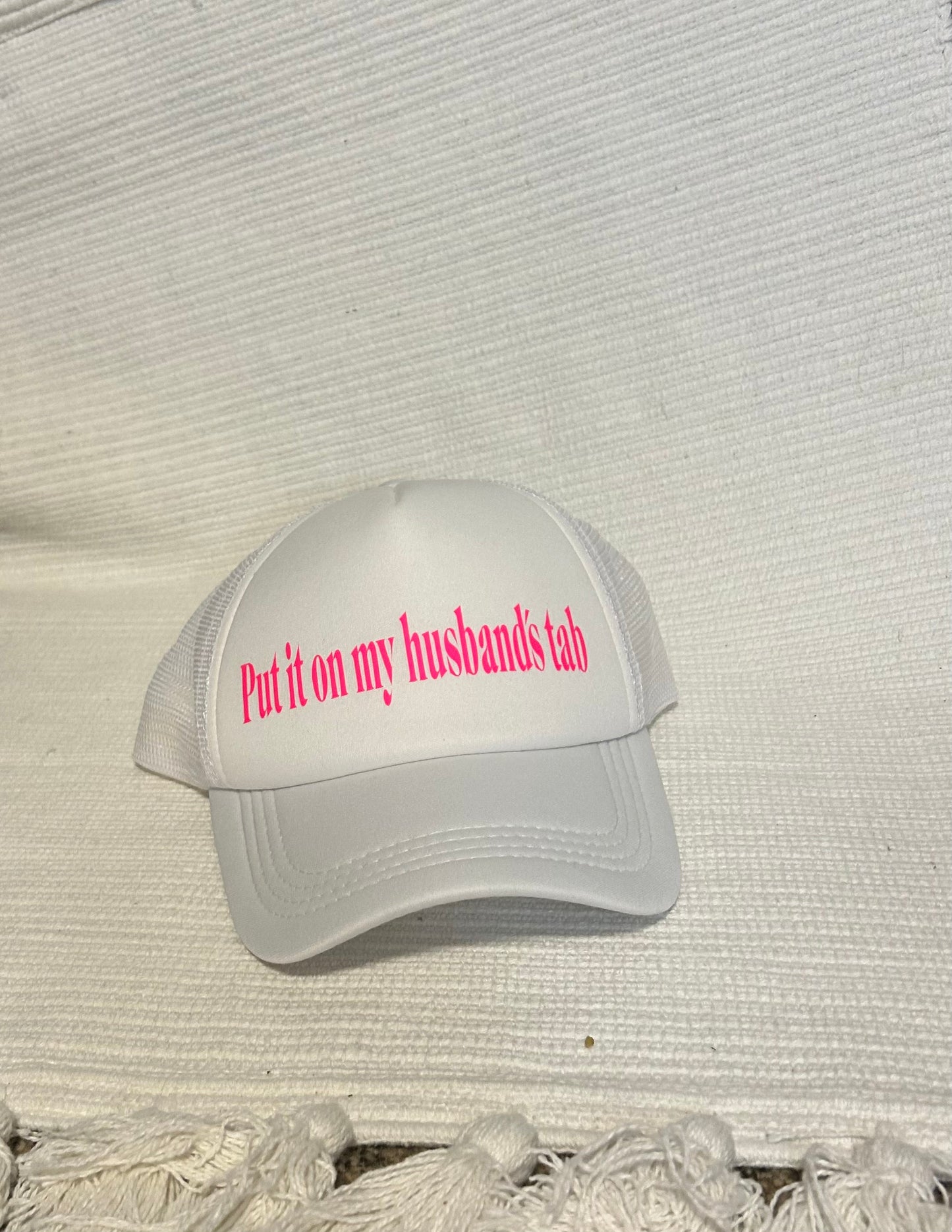 Put It On My Husbands Tab Trucker Hat